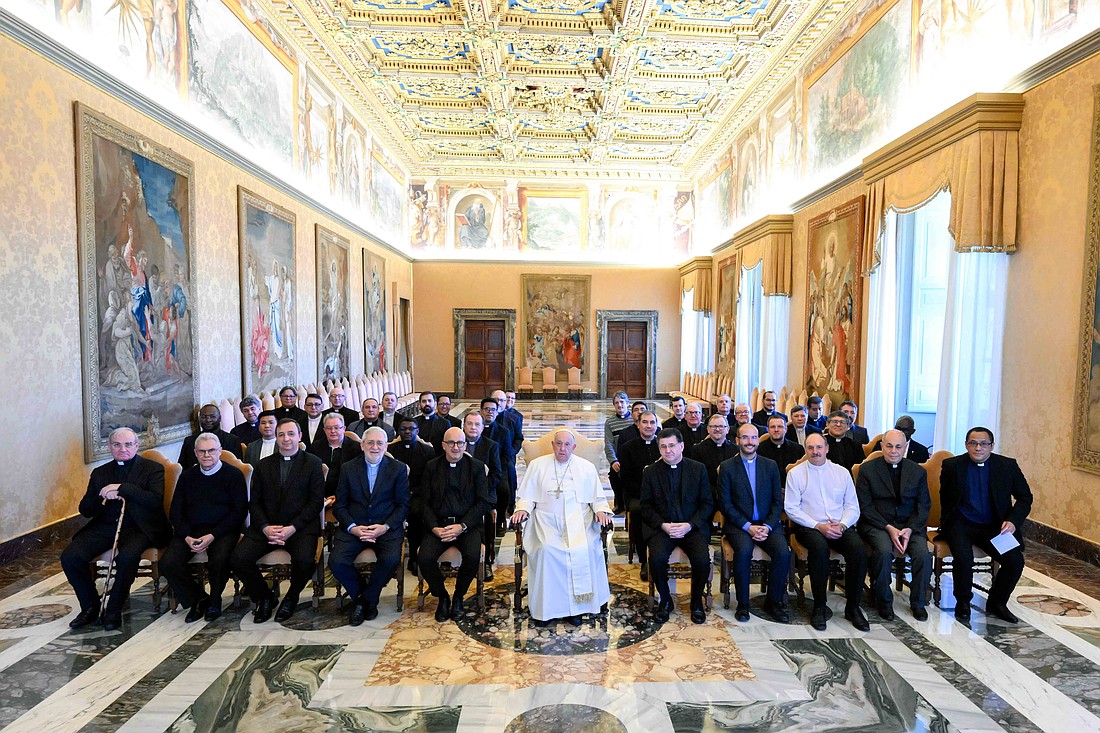 Pope Francis poses for a photo with members of the general chapter of the Scalabrinians at the Vatican Oct. 28, 2024. (CNS photo/Vatican Media)