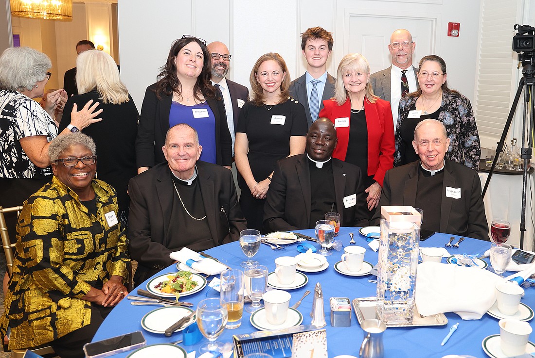 Mount Carmel Guild gala attendees included, from left, front row: Dr. Ellie Ingbritsen, MCG trustee; Bishop David M. O’Connell, C.M.; Father Jean Felicien, priest secretary to the bishop; Msgr. John Dermond, retired priest of the Diocese; back row: Christine Prete, director of the diocesan Department of Development; her husband Jerry Prete; Bonnie Milecki, diocesan assistant superintendent of Catholic schools; her son Jamison Tormey; Brenda Rascher, Bishop’s delegate on the MCG Board of Trustees; Randy Ingbritsen, and Janet L. Boris, associate director of the diocesan Office of Child and Youth Protection. Courtesy photo