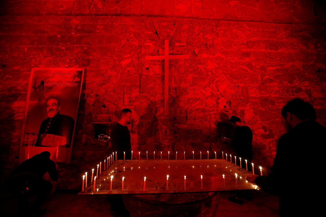 A file photo shows the Chaldean Church of St. Paul in Mosul, Iraq,  illuminated with red light in protest against the persecution of Christians around the world. (OSV News photo/Khalid Al-Mousily, Reuters)