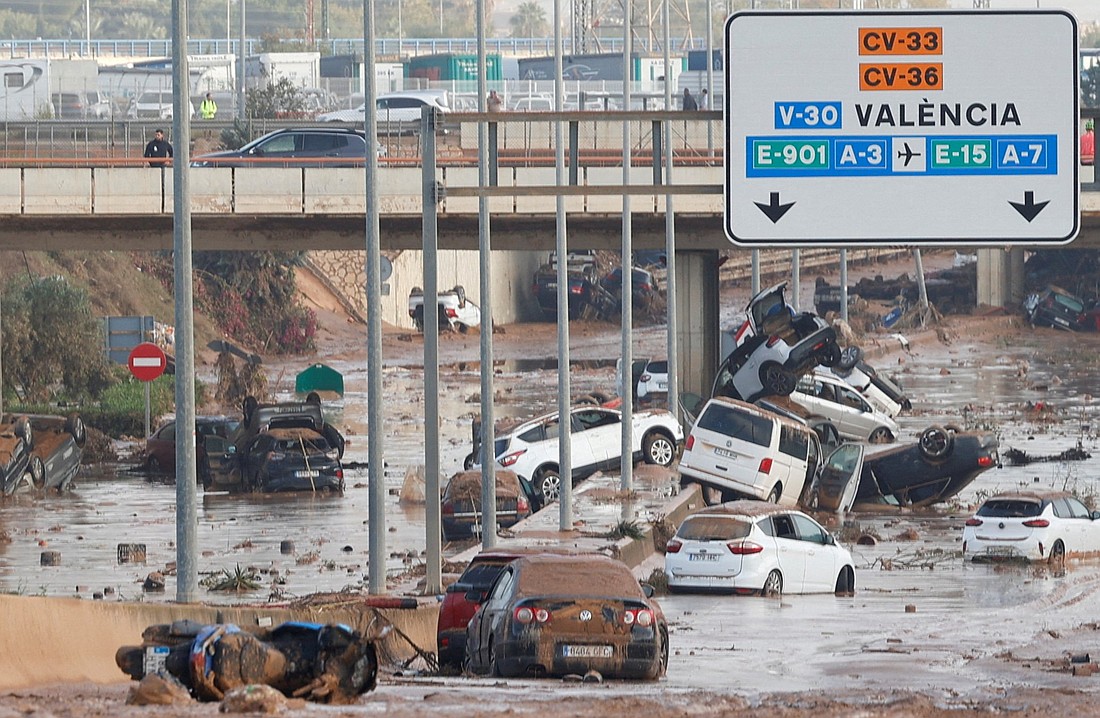 Damaged cars are seen along a road on the outskirts of Valencia, Spain, Oct. 31, 2024, affected by torrential rains that caused flooding. Archbishop Enrique Benavent of Valencia expressed "grave concern" and said Mass for those affected after at least 95 people died, and many more went missing amid torrential rains that caused massive flooding. (OSV News photo/Eva Manez, Reuters)