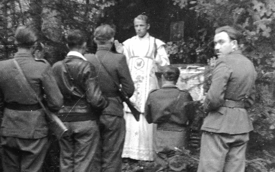 Jesuit Father Wladyslaw Gurgacz (1914-1949) is seen in an undated photo delivering the homily to post-World War II underground soldiers of the anti-communist resistance. He was branded a "bandit priest," arrested by Polish communists and was shot at Kraków's Montelupich prison after serving as chaplain to one of the partisan groups resisting the postwar communist takeover. (OSV News photo/courtesy Jesuit Archives in Warsaw and Poznan)