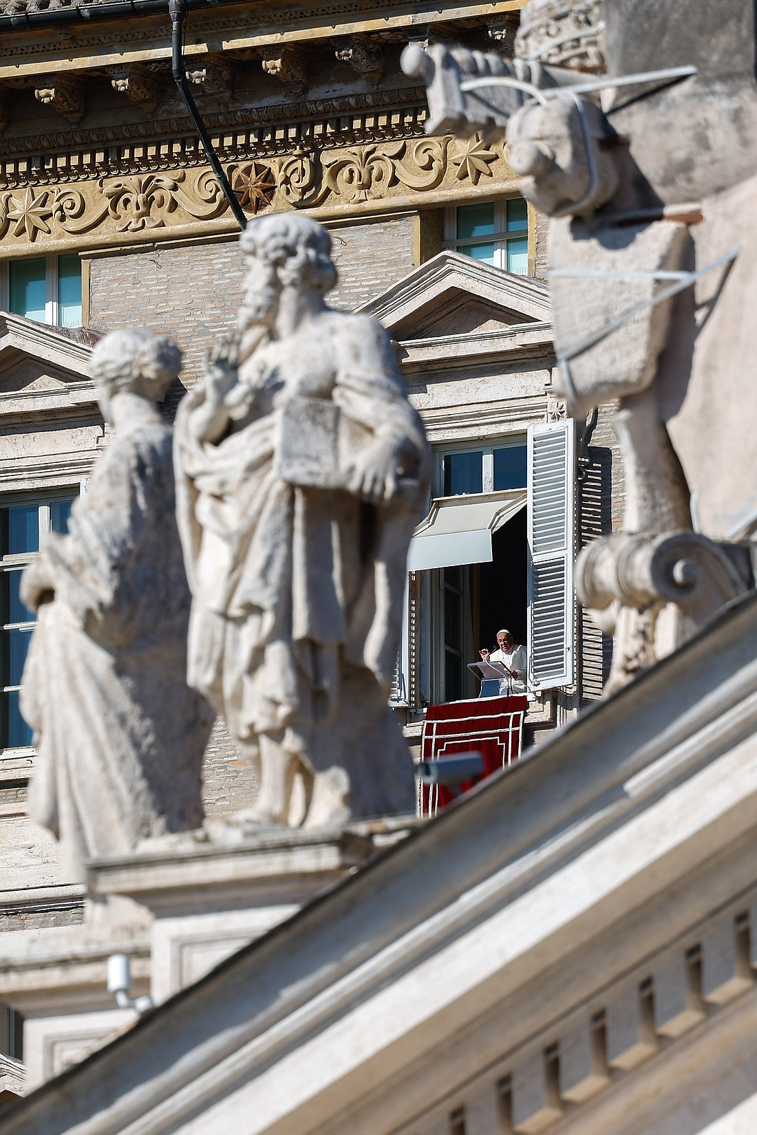 Pope Francis speaks to visitors gathered in St. Peter’s Square at the Vatican for the recitation of the Angelus on the feast of All Saints, Nov. 1, 2024. (CNS photo/Lola Gomez)