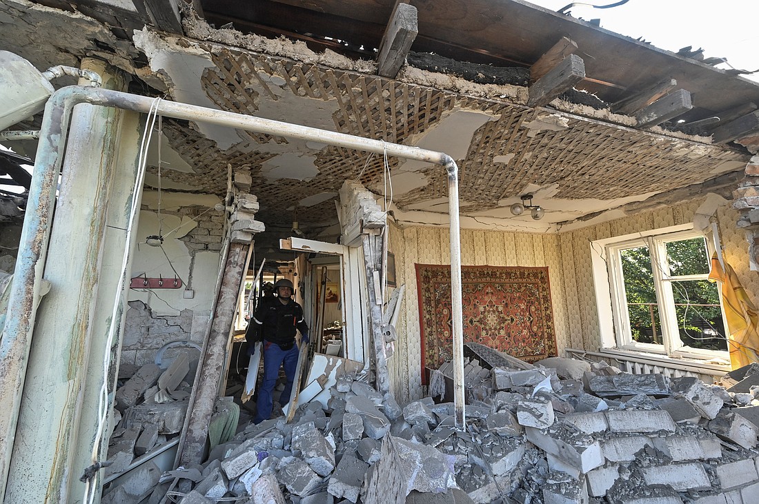 Rescuers inspect a destroyed house in Zaporizhzhia, Ukraine, Oct. 10, 2024, following a Russian airstrike. (OSV News photo/Reuters)