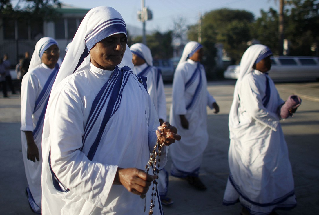 Members of the Missionaries of Charity are pictured in a file photo outside the cathedral in Port-au-Prince, Haiti. On the evening of Oct. 26, 2024, armed gang members looted and then burned a convent and hospital operated by the Missionaries of Charity in Port-au-Prince, Haiti's capital. (OSV News photo/Eliana Aponte, Reuters)