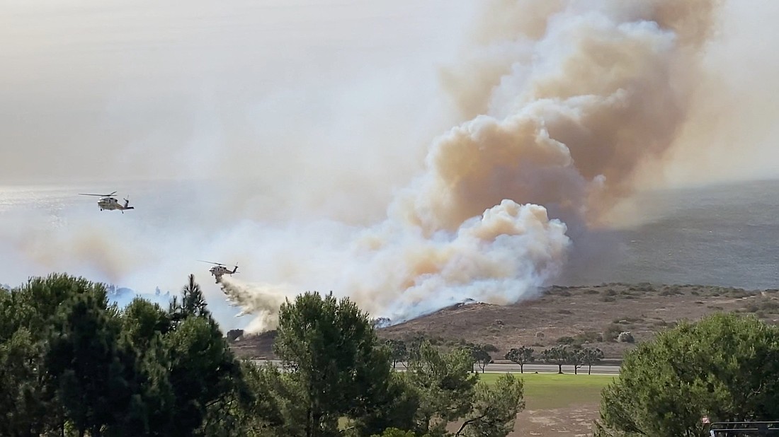 Firefighting helicopters operate as a wildfire burns in Malibu, Calif., Nov. 6, 2024, in this still image obtained from social media video. (OSV News photo/Courtney Davis via Reuters) Editors:  THIS IMAGE HAS BEEN SUPPLIED BY A THIRD PARTY. MANDATORY CREDIT. NO RESALES. NO ARCHIVES.