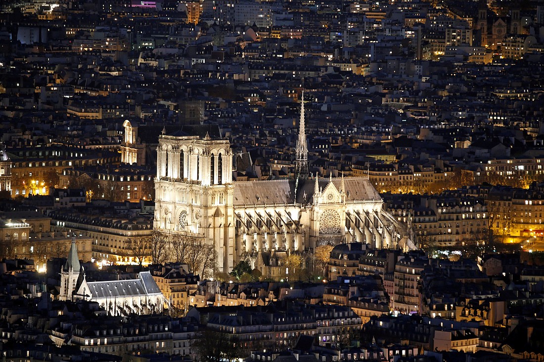 The Notre Dame Cathedral is seen at night in Paris Nov. 28, 2016. A major blaze engulfed the iconic cathedral April 15, 2019, sending pillars of flame and billowing smoke over the center of the French capital. After five years of restoration work, the cathedral is scheduled to reopen Dec. 8, 2024. (OSV News photo/Charles Platiau, Reuters)