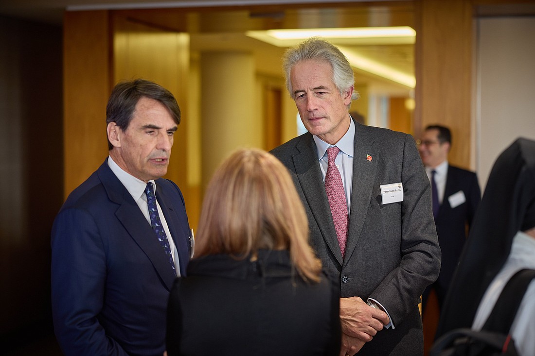 Jean-Baptiste de Franssu, president of the Institute for the Works of Religion, commonly known as the Vatican bank, and Peter Hugh Smith, chief executive of London-based CCLA Investment Management, speak to a participant at the Mensuram Bonam Summit on faith-consistent investing in London Nov. 11, 2024. (CNS photo/Courtesy of CCLA Investment Management, Gordon Stabbins)