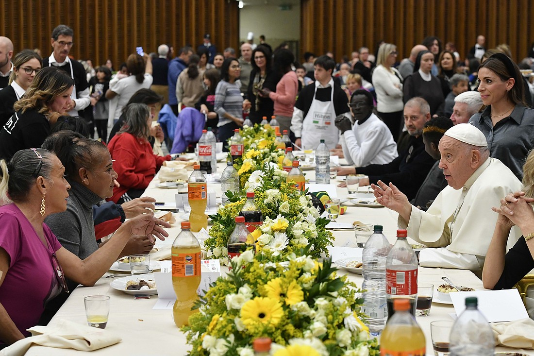 Pope Francis eats lunch with his guests in the Vatican audience hall Nov. 19, 2023, the World Day of the Poor. (CNS photo/Vatican Media)