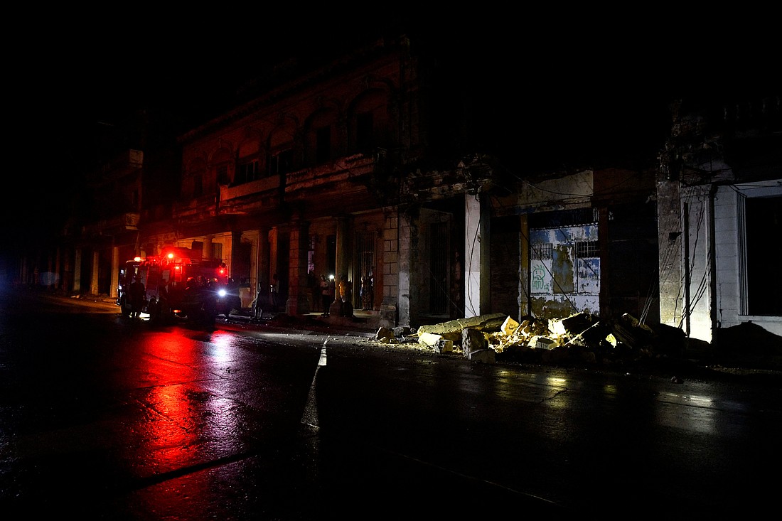 Firefighters check debris from a house during a blackout after Hurricane Rafael knocked out the country's electrical grid, in Havana, Cuba Nov. 7, 2024. Caritas workers in Cuba are responding to people’s needs after the island suffered an earthquake and a hurricane within four days, while reeling from a previous disasters. (OSV News photo/Norlys Perez, Reuters)