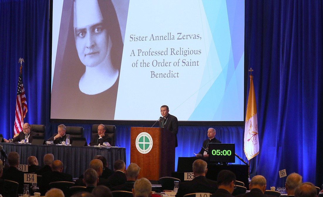 Bishop Andrew H. Cozzens of Crookston, Minn., speaks about the cause of beautification and canonization of Sister Annella Zervas, a professed religious of the Order of St. Benedict, during a Nov. 12, 2024, session of the fall general assembly of the U.S. Conference of Catholic Bishops in Baltimore. Also pictured are Father Michael J.K. Fuller, USCCB general secretary; Archbishop Timothy P. Broglio of the U.S. Archdiocese for the Military Services, USCCB president; Archbishop William E. Lori of Baltimore, USCCB vice president; and Bishop Thomas J. Paprocki of Springfield, Ill. (OSV News photo/Bob Roller)