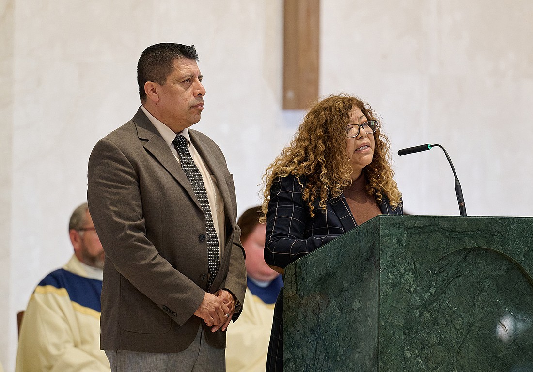 Rosario and Javier Ramirez of St. Mark Parish, Sea Girt, and members of the Diocesan Spanish Pre-Cana Team, proclaim a Reading during the Oct. 6 Mass in St. Robert Bellarmine Co-Cathedral, Freehold. Mike Ehrmann photo