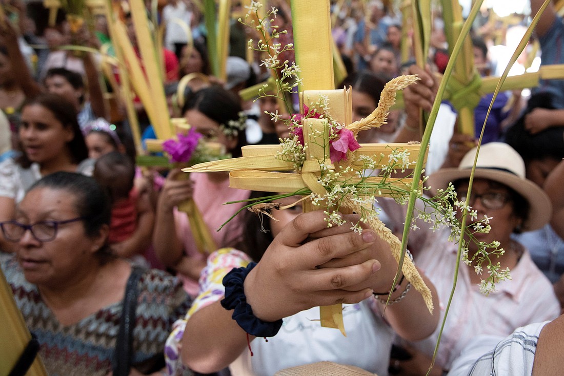 People raise their palm fronds for blessings during a Palm Sunday Mass in Managua, Nicaragua, March 24, 2024. (OSV News photo/Maynor Valenzuela, Reuters)