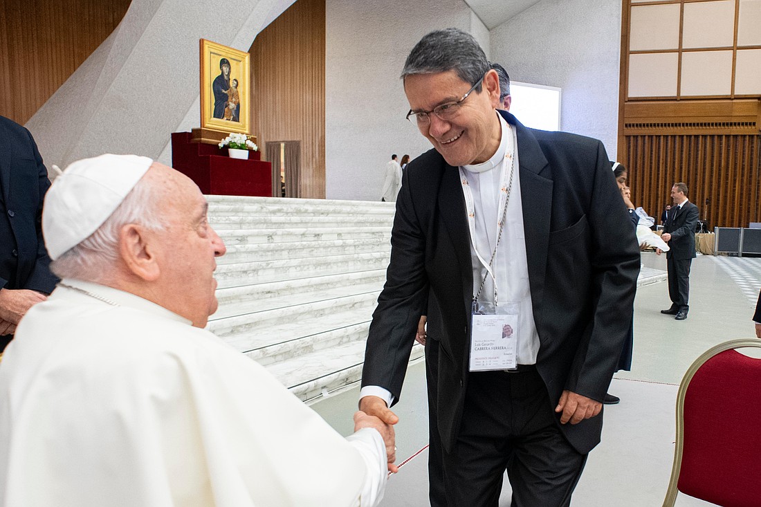 Pope Francis greets Cardinal-designate Luis Cabrera Herrera of Guayaquil, Ecuador, during a meeting of the Synod of Bishops in the Paul VI Audience Hall at the Vatican Oct. 8, 2024. (CNS photo/Vatican Media)