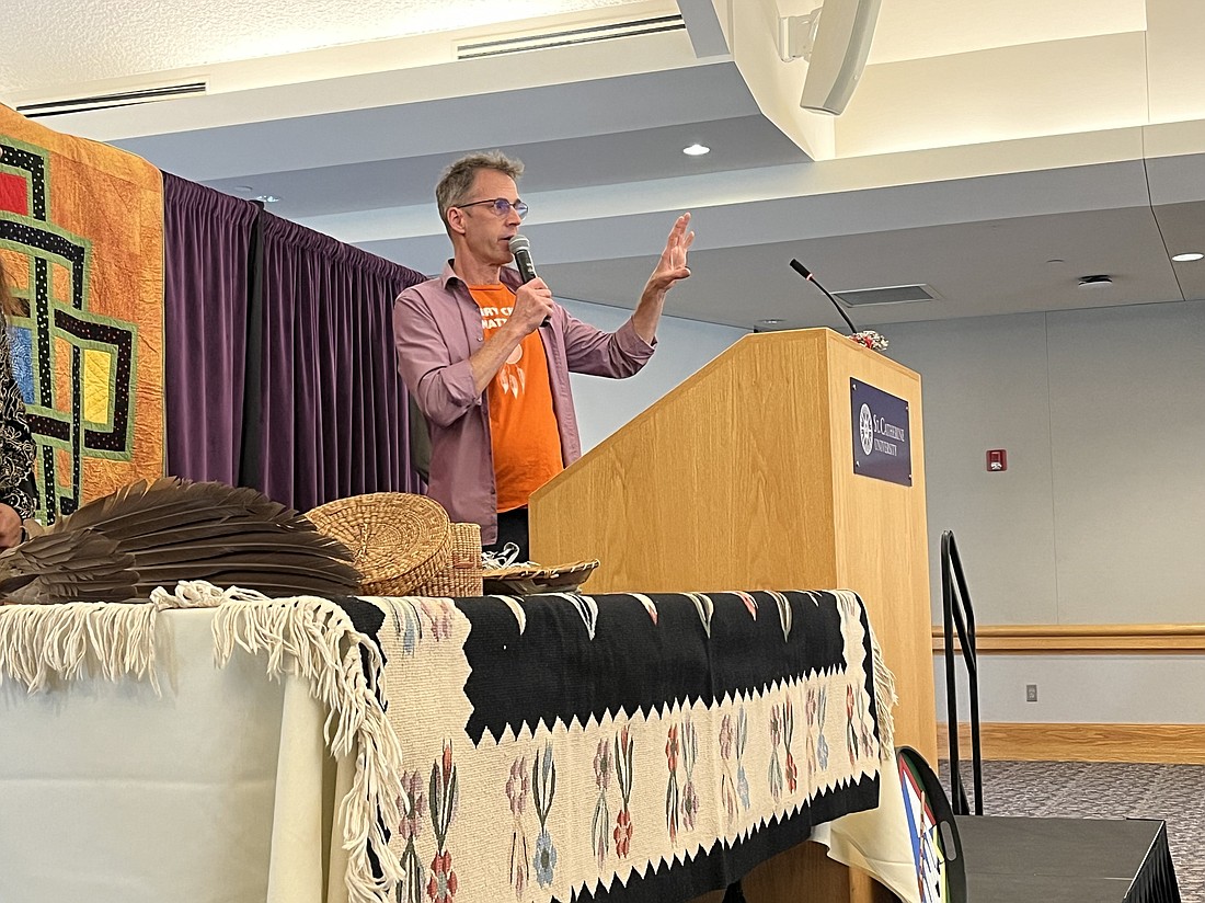 Robert Haarman, director of the Office of Indian Ministry of the Archdiocese of St. Paul and Minneapolis and community minister at Gichitwaa Kateri Catholic Church in Minneapolis, addresses attendees at an Oct. 5, 2024, event at St. Catherine University in St. Paul on the harm caused by government-funded boarding schools for Native American children that forced them to assimilate to a European and Christian way of life, suppressing their language and culture in the process. Some of the schools were operated by Catholic religious orders. (OSV News photo/Rebecca Omastiak, The Catholic Spirit)