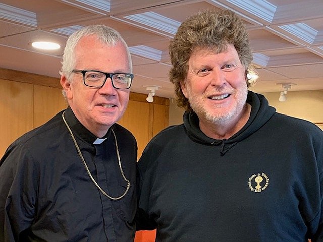 Eddie Cotter, right, founder and director of the Dead Theologians Society, is seen in this undated photo with Bishop Donald J. Hying of Madison, Wis., where the society, which invites youth to learn about the lives of the saints and to pray for the souls in purgatory, is based. (OSV News photo/courtesy of Eddie Cotter) EDITORS: Best quality available.