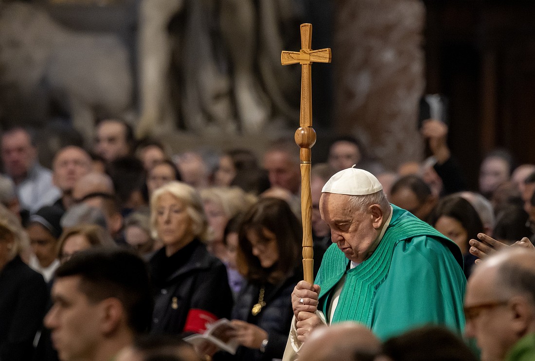 Pope Francis leans on his crosier as he prays during Mass for the World Day of the Poor in St. Peter's Basilica at the Vatican Nov. 17, 2024. (CNS photo/Pablo Esparza)