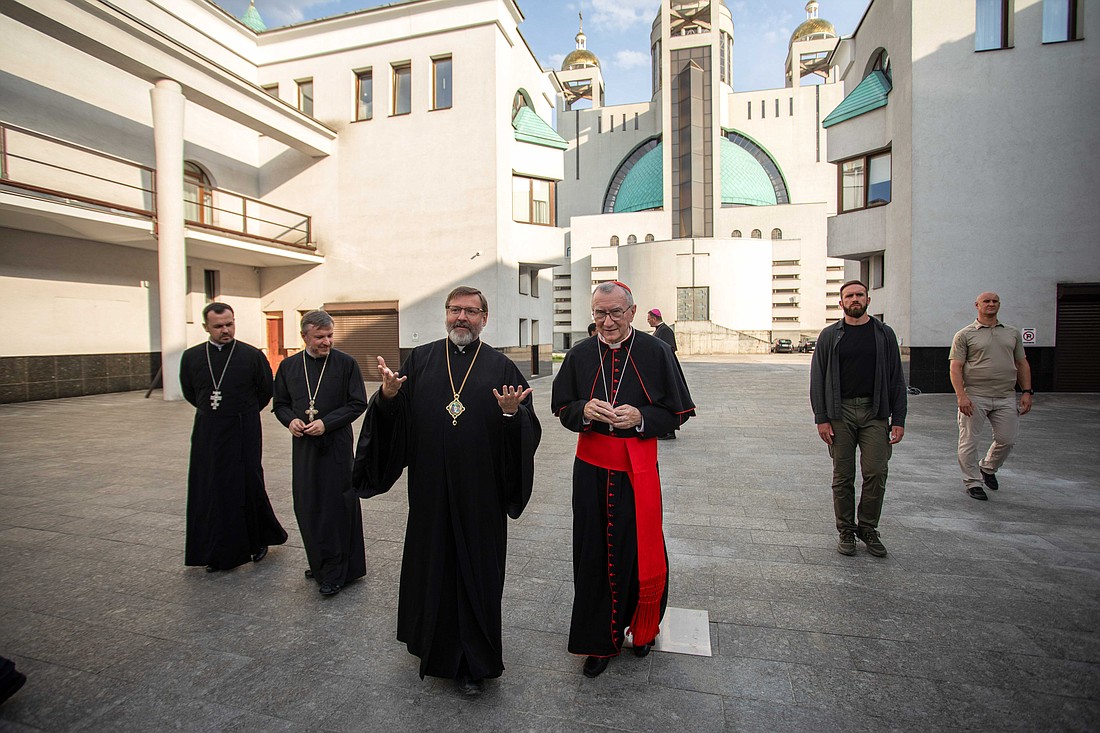 Cardinal Pietro Parolin, Vatican secretary of state, and Archbishop Sviatoslav Shevchuk, major archbishop of Kyiv-Halych, talk during Cardinal Parolin's visit to the headquarters of the Ukrainian Greek Catholic Church in Ukraine on July 21, 2024. (CNS photo/courtesy of Ukrainian Greek Catholic Church)