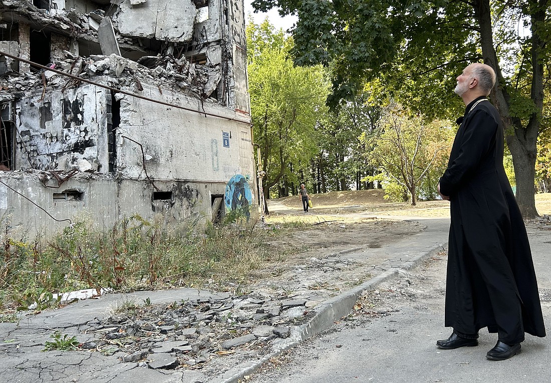 Metropolitan Archbishop A. Gudziak of the Ukrainian Greek Catholic Archeparchy of Philadelphia inspects a residential building Sept. 8, 2024, that was destroyed by Russian glide bombs in Kharkiv, Ukraine, located within 30 miles of the frontline of Russia's 11-year invasion of that nation. (OSV News photo/Gina Christian)