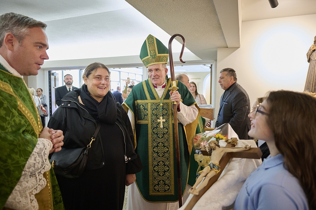 Father Brian Patrick Woodrow, pastor of St. Dominic Parish, Brick, introduces students from the parish school and religious education program to Antonia Salzano and Bishop O'Connell before the start of Mass. Mike Ehrmann photo