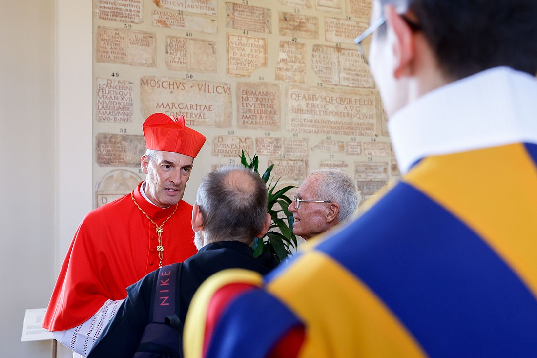 Cardinal François-Xavier Bustillo of Ajaccio, on the French island of Corsica, greets well-wishers in the Apostolic Palace at the Vatican after a consistory where Pope Francis made him and 20 other prelates cardinals Sept. 30, 2023. (CNS photo/Lola Gomez)