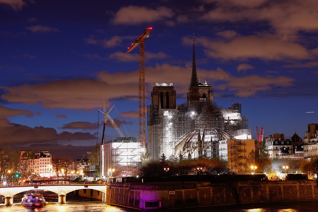 A night view shows the Notre Dame Cathedral in Paris March 30, 2024, with a new spire topped by the rooster and the cross, as restoration works continued following the devastating fire of 2019. (OSV News photo/Gonzalo Fuentes, Reuters)