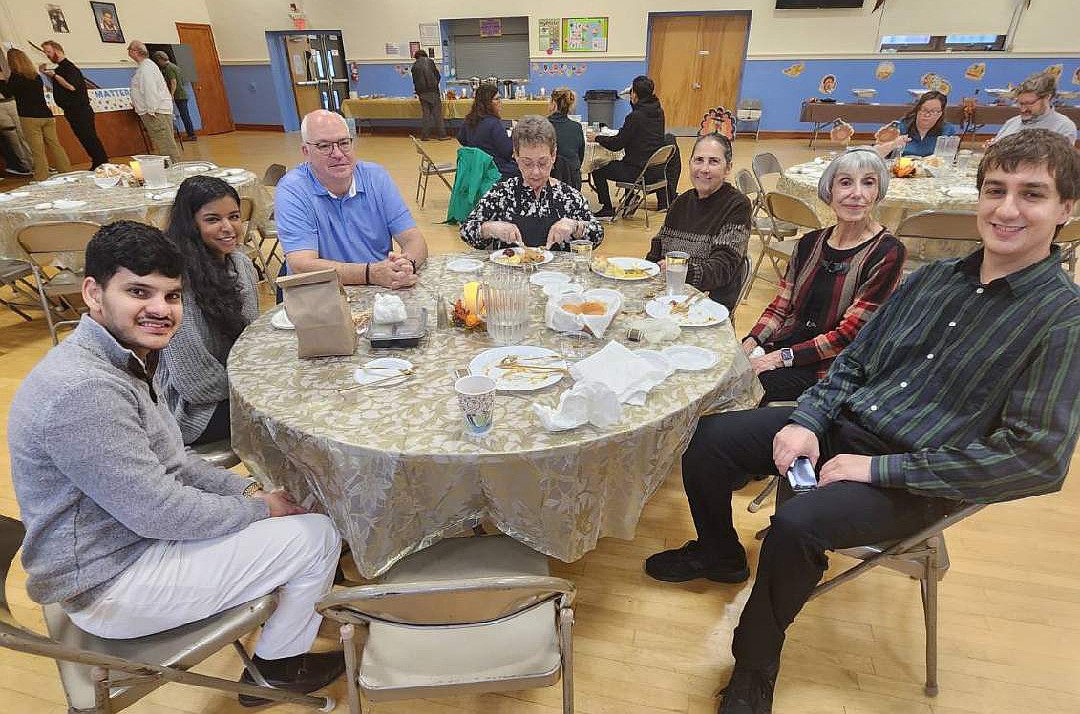 Guests enjoy their Thanksgiving Day dinner in St. Mary of the Lakes School. Courtesy photo