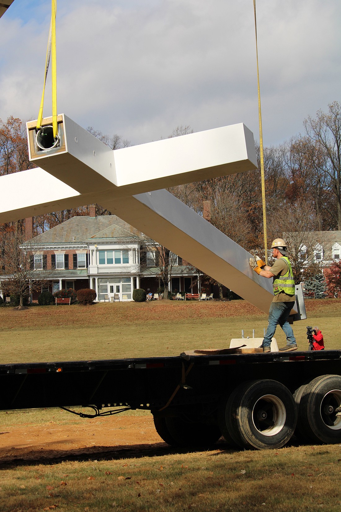 Workers erect a giant cross Nov. 11, 2024, at Malvern Retreat House in Malvern, Pa. The 34-foot-tall was at the center of a Mass celebrated by St. John Paul II Oct. 3, 1979, in Center City Philadelphia. The Mass drew more than a million people. (OSV News photo/Joseph P. Owens,Dialog photo)
