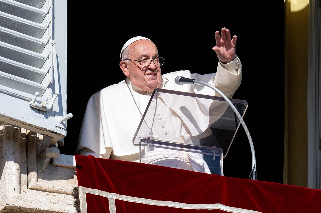 Pope Francis greets people joining him for the recitation of the Angelus prayer in St. Peter's Square at the Vatican Dec. 1, 2024. (CNS photo/Vatican Media)