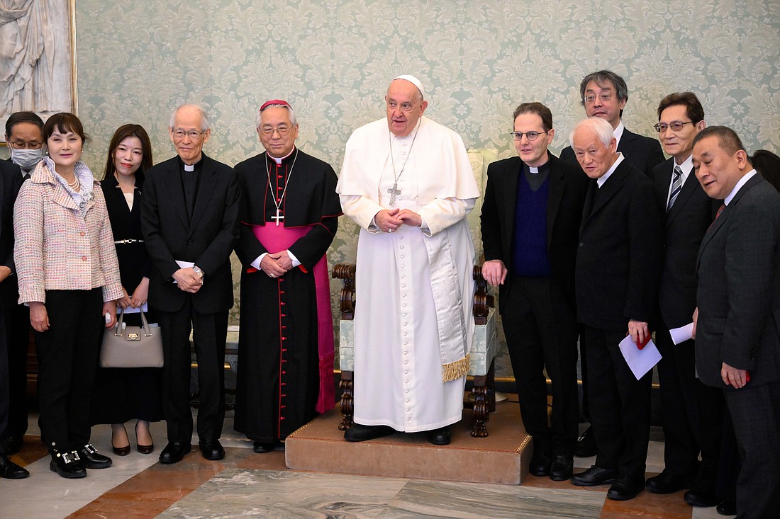 Pope Francis poses for a photo at the Vatican Nov. 30, 2024, eith a group dedicated to preserving the memory of Japan's "Hidden Christians," encouraging them to also remember and pray for Christians who face persecution today. (CNS photo/Vatican Media)
