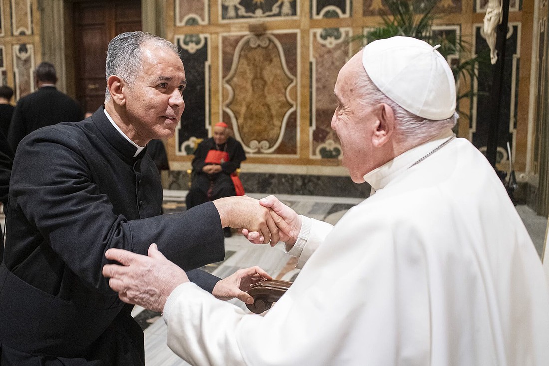 Father Javier A. Diaz, pastor of Christ the King Parish, Long Branch, greets Pope Francis in Rome Nov. 23 during a workshop. Courtesy photo