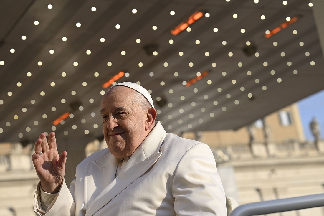 Pope Francis waves from his popemobile in St. Peter's Square during his weekly general audience at the Vatican Dec. 4, 2024. (CNS photo/Vatican Media)