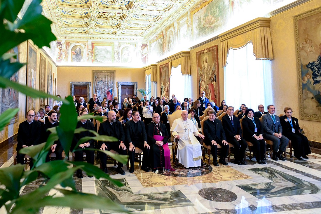 Pope Francis poses for a photo with Caritas workers from the Archdiocese of Toledo, Spain, during a meeting at the Vatican Dec. 5, 2024. (CNS photo/Vatican Media)