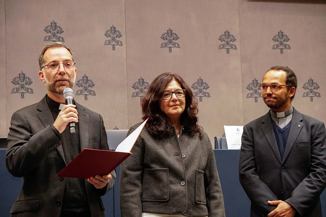 From left, Jesuit Father Cristobal Fones, acting international director of the Pope's Worldwide Prayer Network, speaks at an event at the Vatican Dec. 5, 2024. He is joined by Bettina Raed, international vice director of the network, and Jesuit Father Miguel Pedro Melo, who will join Raed as co-international vice director in July 2025. (CNS photo/Carol Glatz)