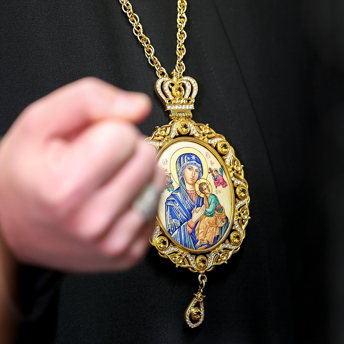 Cardinal-designate Bishop Mykola Bychok, head of the Ukrainian Greek Catholic Eparchy of Sts. Peter and Paul of Melbourne, Australia, wears an encolpion around his neck featuring an icon of Our Lady of Perpetual Help as he speaks to reporters at the Vatican Dec. 6, 2024. (CNS photo/Lola Gomez)