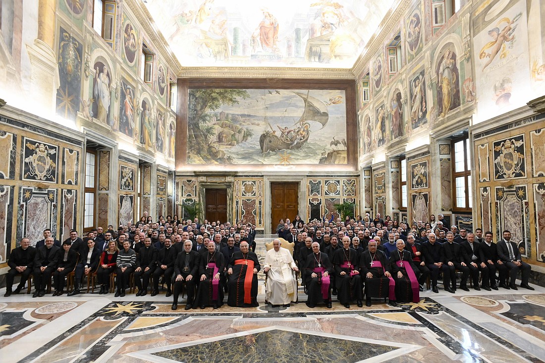 Pope Francis poses for a photo with staff and students from St. Paul Theological School in Catania, Italy, during an audience at the Vatican Dec. 6, 2024. (CNS photo/Vatican Media)