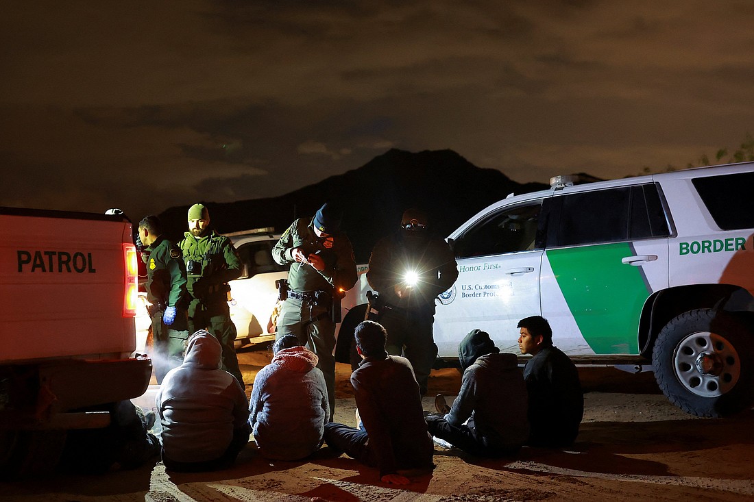 Migrants are detained by U.S. Border Patrol agents in Sunland Park, N.M., after they crossed into the United States from Mexico, Nov. 4, 2024. New Mexico's Catholic bishops have called on President-elect Donald Trump to reconsider his plans to carry out the largest deportation in U.S. history. (OSV News photo/Jose Luis Gonzalez, Reuters).