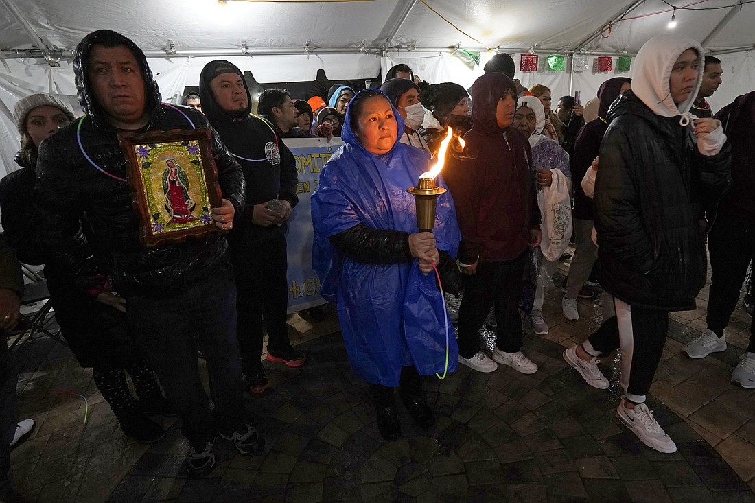A participant in the annual Guadalupe Torch Race ("Carrera Antorcha Guadalupana") arrives at Our Lady of Mount Carmel Church in Staten Island, N.Y., Dec. 11, 2022, the eve of the feast of Our Lady of Guadalupe. The annual torch relay run honoring the patroness of Mexico and the Americas begins at the Basilica of Our Lady of Guadalupe in Mexico City and concludes at St. Patrick's Cathedral in New York City on the feast of Our Lady of Guadalupe Dec. 12. (OSV News photo/Gregory A. Shemitz)