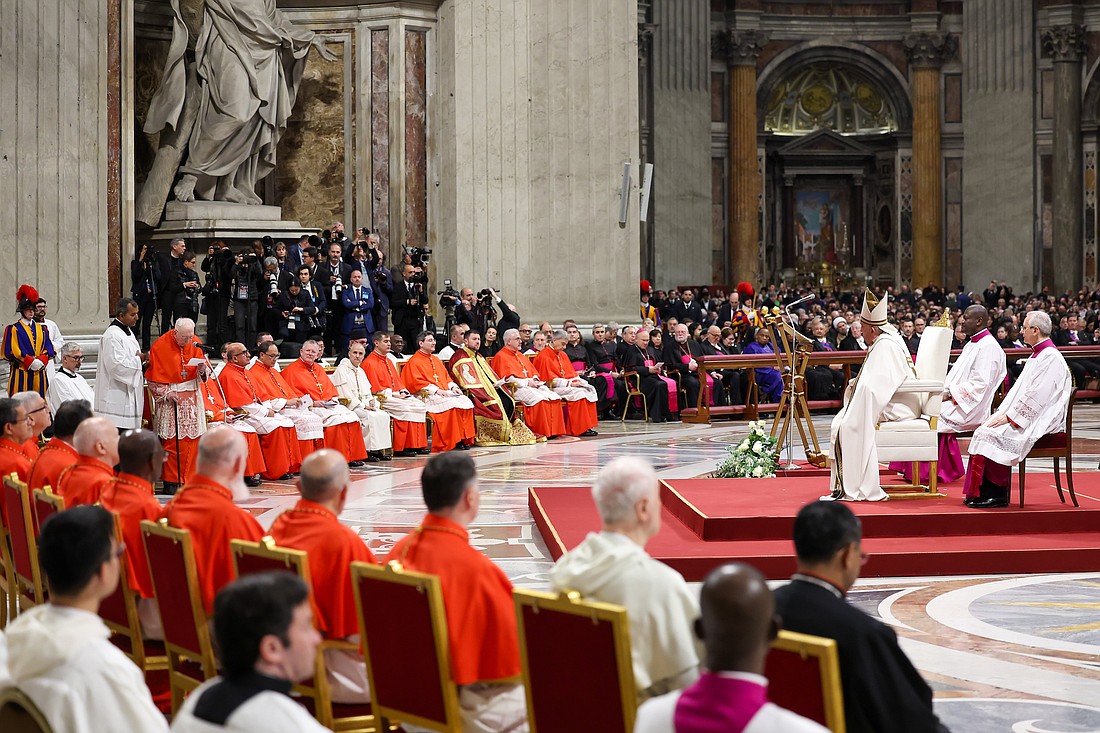 Pope Francis listens as Cardinal Angelo Acerbi, a 99-year-old retired Vatican diplomat, thanks him on behalf of the 21 new cardinals created at a consistory Dec. 7, 2024, in St. Peter's Basilica at the Vatican (CNS photo/Lola Gomez)