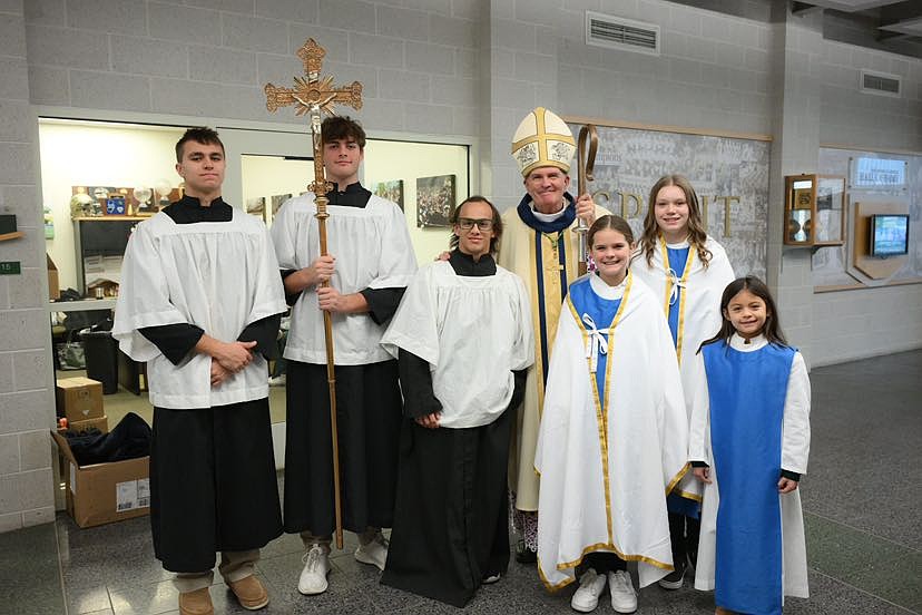 Bishop O'Connell poses for a photo with altar servers during his visit to  Red Bank Dec. 9. Mike Ehrmann photo