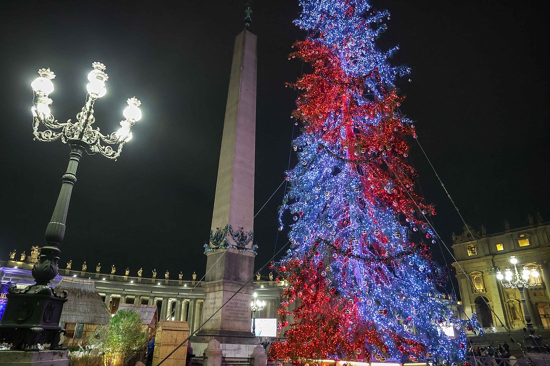 The Christmas tree is lighted in St. Peter's Square at the Vatican Dec. 7, 2024. (CNS photo/Lola Gomez)