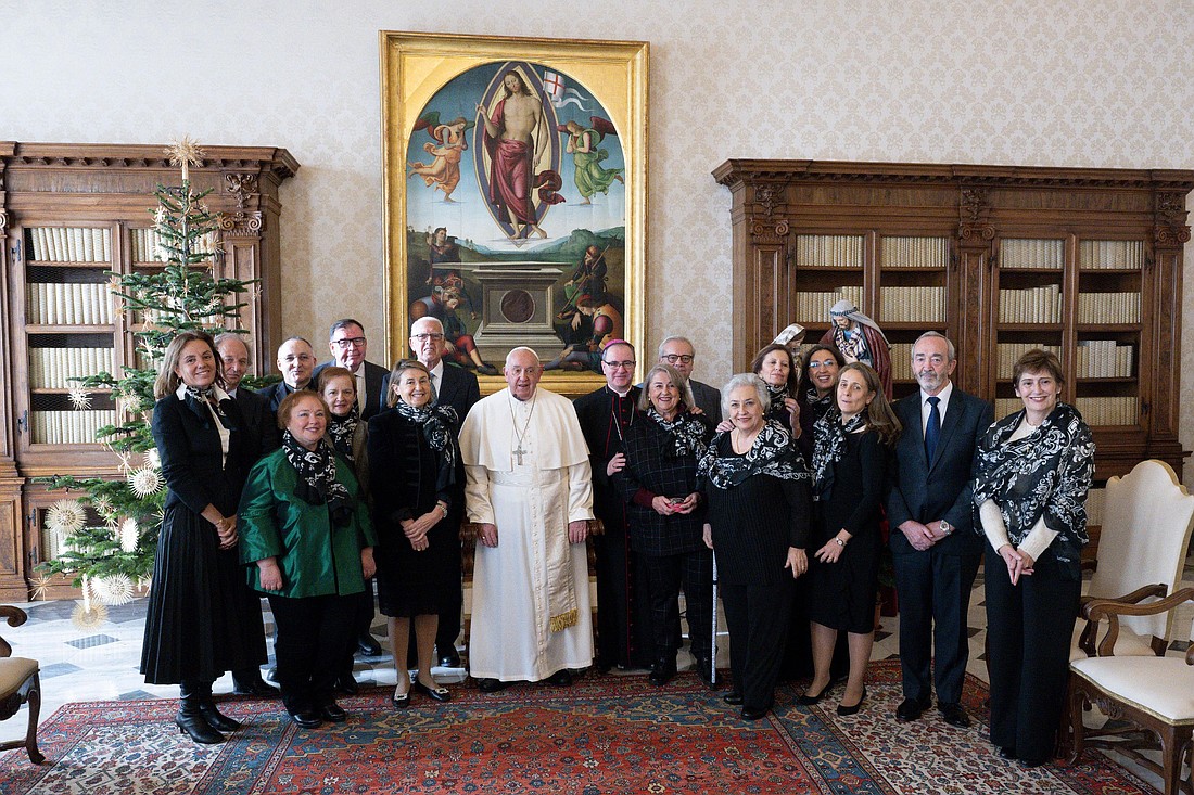 Pope Francis poses for a photograph with a delegation of Manos Unidas during an audience in the Apostolic Palace at the Vatican Dec. 9, 2024. Manos Unidos is a Catholic organization based in Spain that promotes aid and development in developing nations, particularly in the fight against hunger. (CNS photo/Vatican Media)