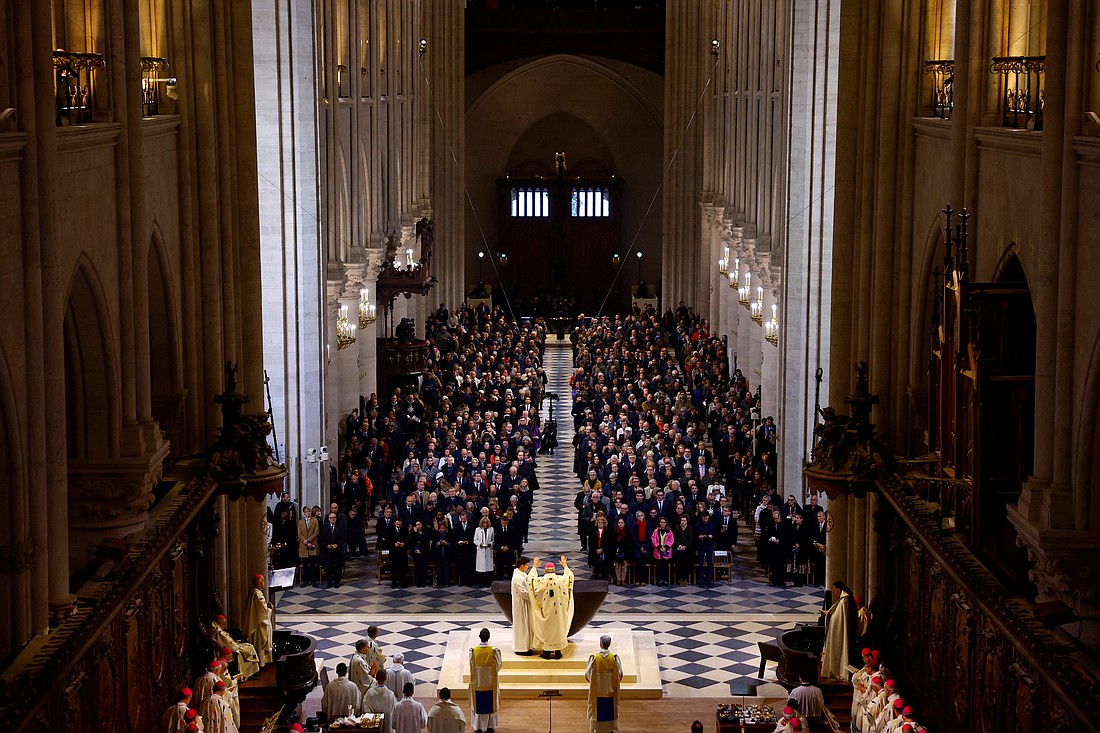 Archbishop Laurent Ulrich of Paris blesses the altar during the inaugural Mass at Notre Dame Cathedral in Paris, five-and-a-half years after a fire ravaged the Gothic masterpiece, as part of ceremonies to mark the cathedral's reopening after its restoration, in Paris, Dec. 8, 2024. (OSV News photo/Sarah Meyssonnier, Reuters)