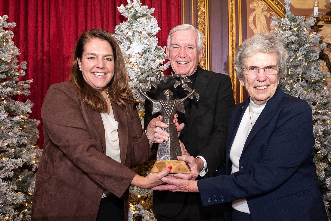 Father Jack Wall, president of the Catholic Extension Society, poses with Kerry Alys Robinson, president and CEO of Catholic Charities USA, left, and Sister Carol Keehan, a Daughter of Charity, after Robinson was awarded Catholic Extension's 2024 Spirit of Francis Award in New York City Dec. 3. Sister Keehan, retired president and CEO of the Catholic Health Association of the United States, received the award in 2022. (OSV News photo/Catholic Extension)