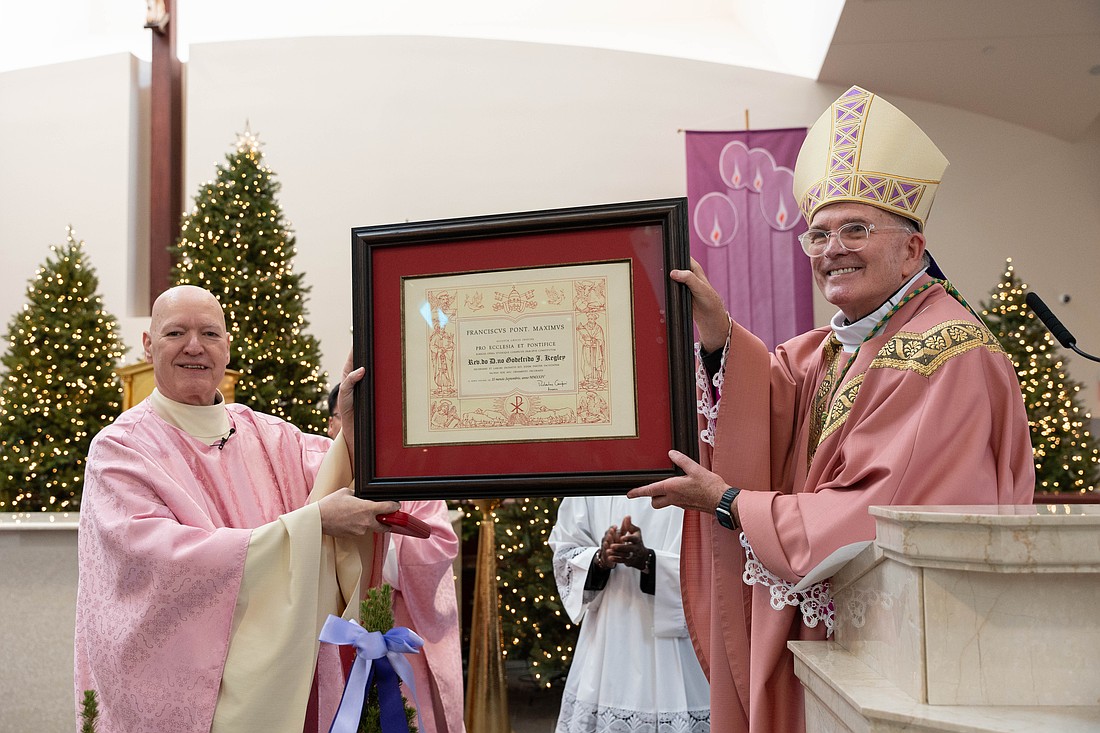 Bishop O'Connell presents Father Kegley with the papal honor during a Dec. 15 Mass in St. Mary Church, Middletown. Matt Marzorati photo