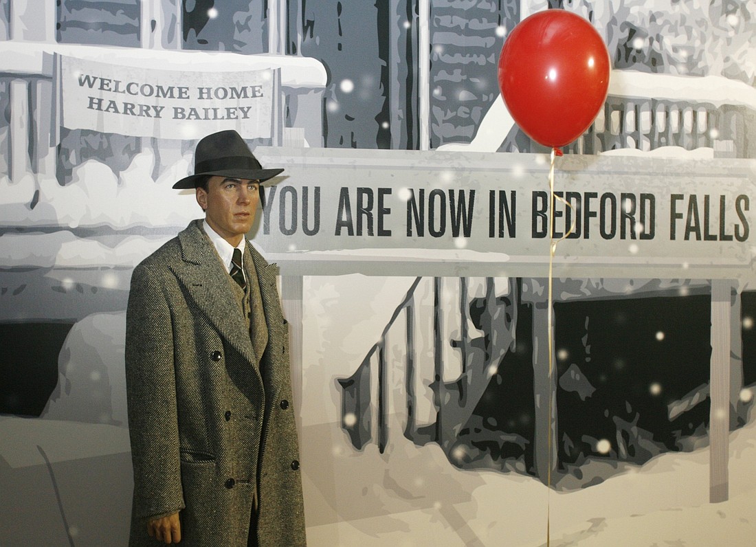 A wax figure of actor Jimmy Stewart is seen with a painted backdrop resembling a scene from "It's A Wonderful Life" at Madame Tussauds Hollywood during a press preview June 11, 2009. (OSV News photo/Fred Prouser, Reuters)