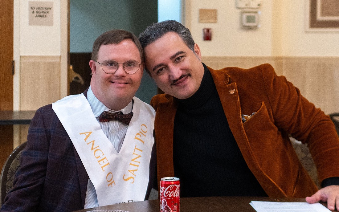 Eric Latcheran, a young man with Down syndrome, has been appointed as the first "Angel of St. Pio" by the St. Pio Foundation for his extraordinary faith and perseverance amid difficulties -- and for his intense devotion to the beloved saint. He is pictured next to Luciano Lamonarca, founder and CEO of the St. Pio Foundation, during an event at the Casa Italiana in Washington, on Dec. 4, 2024. (OSV News photo/courtesy of the Saint Pio Foundation)