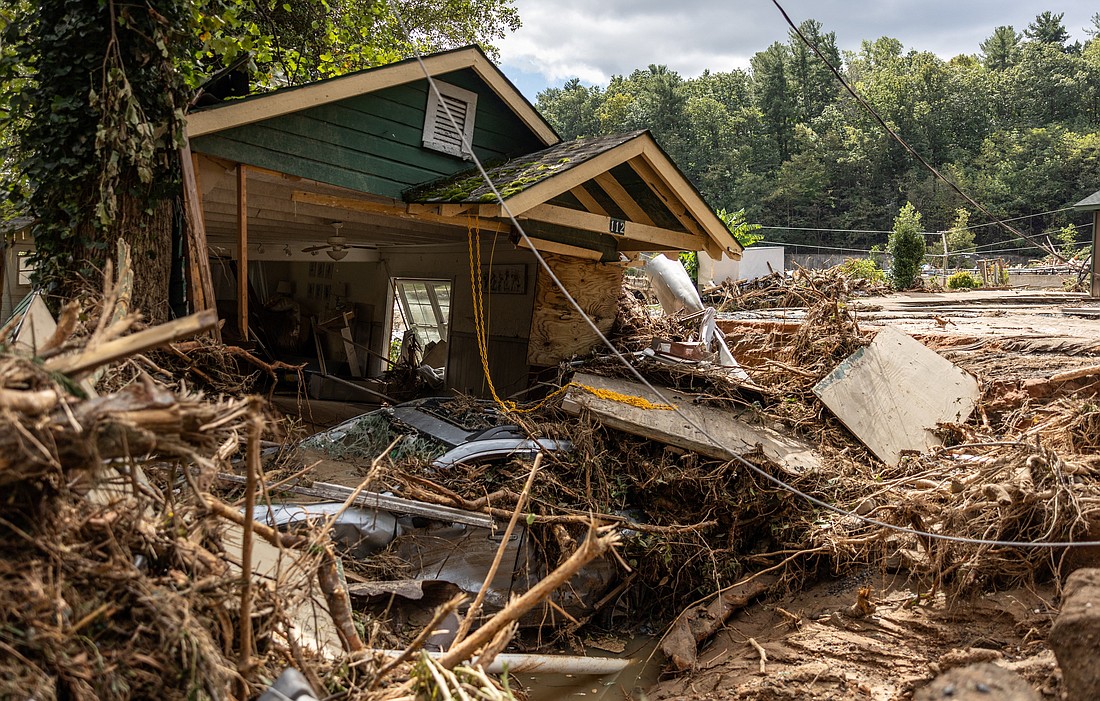 A destroyed house with a car under it in Chimney Rock, N.C., is seen Sept. 29, 2024, after the remnants of Hurricane Helene hit the town. The storm made landfall on Sept. 26 in Florida's Big Bend region as a Category 4 hurricane and was downgraded to a tropical storm the next morning. (OSV News photo/Khadejeh Nikouyeh, The Charlotte Observer handout via Reuters) Editors: THIS IMAGE HAS BEEN SUPPLIED BY A THIRD PARTY. MANDATORY CREDIT. NO RESALES. NO ARCHIVES