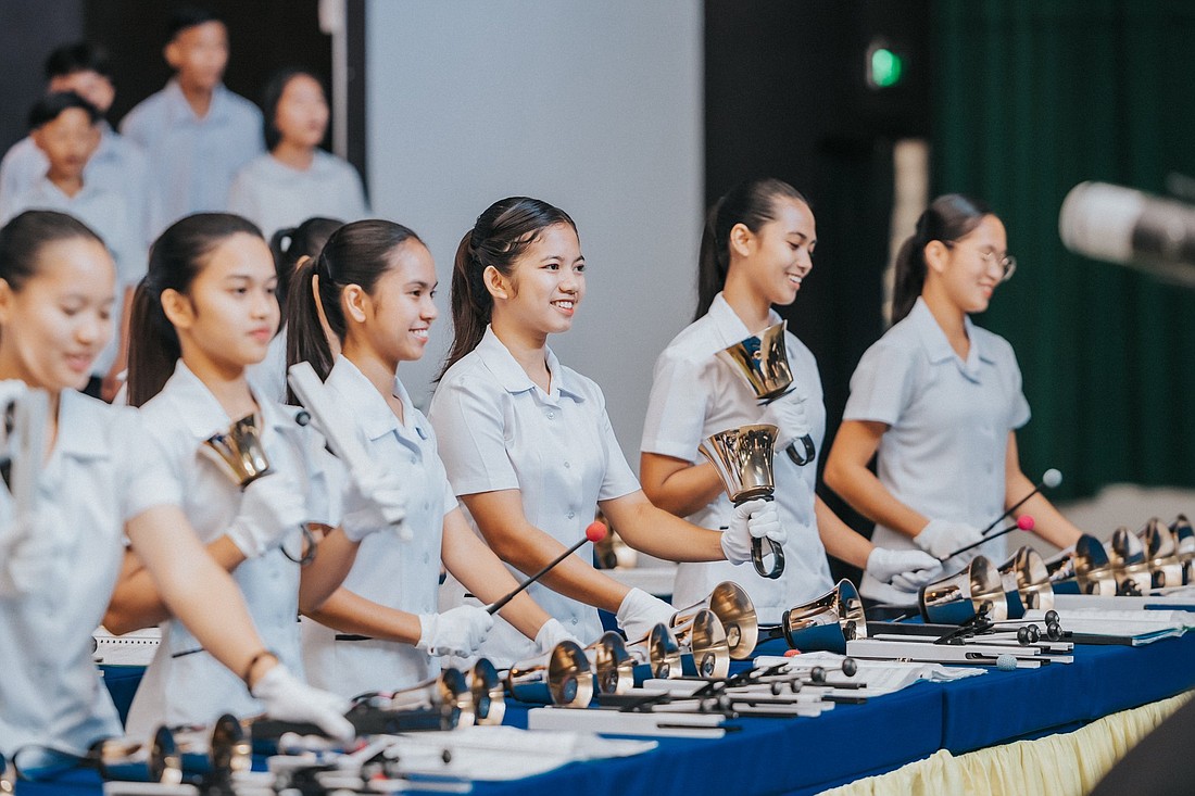 High school handbell students of the Sisters of Mary Schools in the Philippines are pictured in an undated photo playing their instruments during recording of the video "It's That Time Of Year" a new Christmas song produced by some members of the multi-platinum hip-hop/pop group Black Eyed Peas and sung by the students. (OSV News photo/courtesy production team)