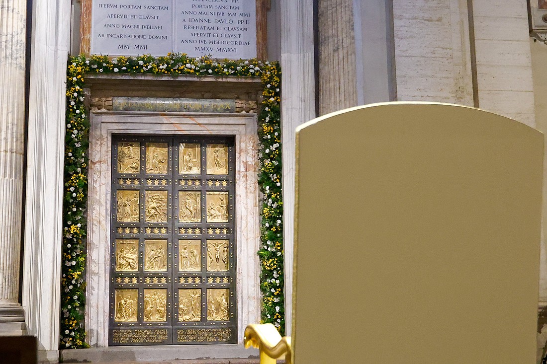 A chair assigned for Pope Francis is placed in front of the Holy Door of St. Peter's Basilica at the Vatican May 9, 2024. (CNS photo/Lola Gomez)