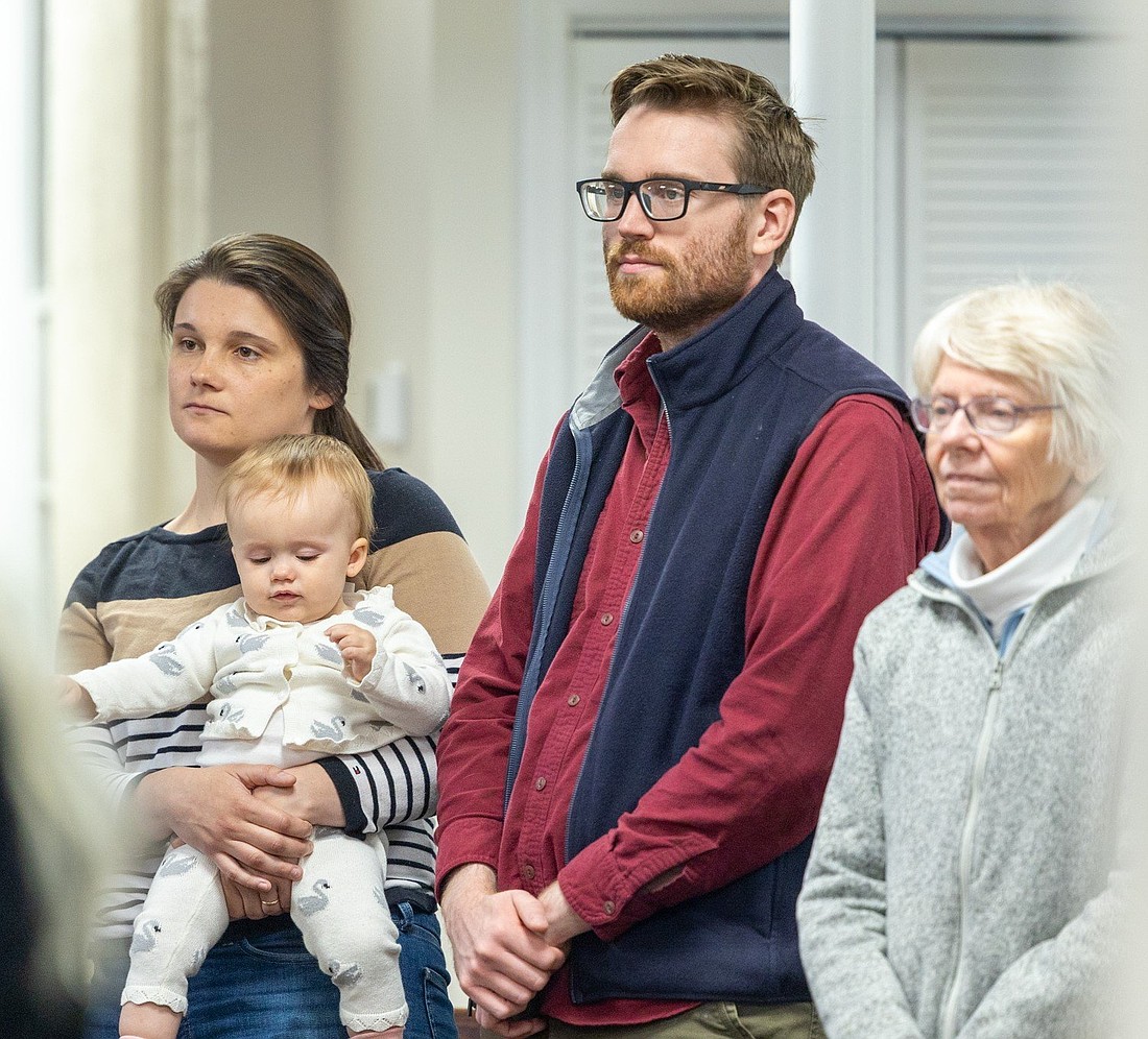 In this file photo, Kathryn Yanik, the director of the Office of Life Issues of the Archdiocese of Washington, holds her baby daughter, Clare, and is joined by her husband, Robert Yanik, and her mother-in-law, Marianne Yanik, at a May 11, 2024, Mass at the Pope Francis Center in Landover Hills, Md., for people living with mental health challenges. The Divine Fulfillment Online Conference for Mental Health and Mental Prayer taking place Dec. 27-29, 2024, aims to help engage Catholics more widely in the U.S. bishops' mental health campaign. (OSV News photo/Mihoko Owada, Catholic Standard)